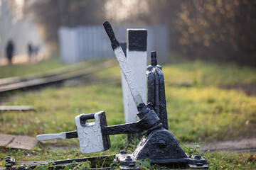 A freshly painted railroad track switching mechanism close up.
