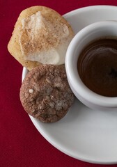A shot of espresso with a home made Irish cream and espresso coin cookie.