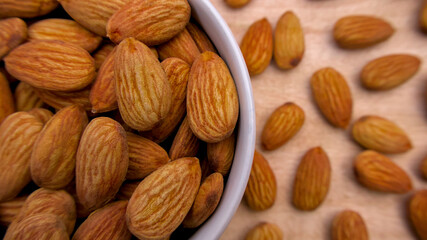 Close-Up of Raw Almonds in a White Bowl with a Soft Blurred Background