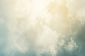 Obraz premium Soft cloudy sky with warm sunlight blending into pale blue tones, creating a serene and dreamy atmosphere