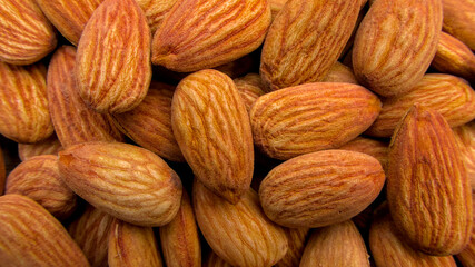 Close-Up of Whole Raw Almonds with Textured Shells for Healthy Eating and Cooking