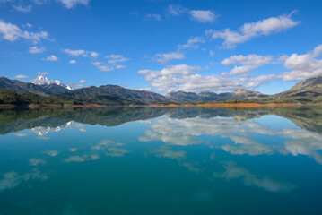 African lake, sunset in an African lake full of green grass and blue water with clouds, African landscape and lake and river water in Jijel, Algeria, nature and environment of Africa, Bodies of Water.