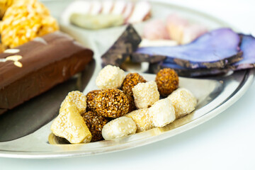 A Plate of jaggery, sesame balls, yam, sweet potato for Maghe Sankranti Festival or Pre Workout Meal