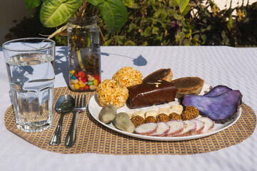 A Plate of jaggery, sesame balls, yam, sweet potato for Maghe Sankranti Festival or Pre Workout Meal