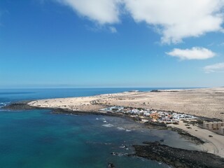 Aerial view of the coastline  with sea views and blue sky background. Taken in Fuerteventura. 
