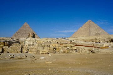 Great Sphinx of Giza with Khafre and Cheops Pyramid in the Background Under the Desert Sun