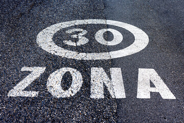 Fototapeta premium 30 km/h zone speed limit road sign painted on the street in Italy.