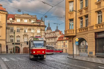 Fototapeten Prag Prague, Czech Republic: Typical Prague Red Tram in Karmelitská Mala Strana  © framarzo