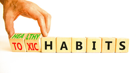 Healthy or toxic habits symbol. Concept words Healthy habits or Toxic habits on beautiful wooden blocks. Beautiful white table white background. Business healthy or toxic habits concept. Copy space.