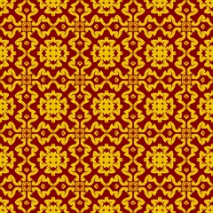 Seamless decorative pattern featuring golden yellow floral and wavy motifs on a rich red background, forming a vibrant and symmetrical design.