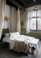 Modern bohemian bedroom with cozy decor and natural light © brizmaker