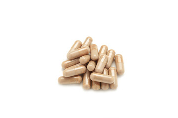 Beige pills isolated on white background. Top view