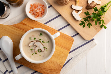Creamy mushroom soup with Shiitake in ceramic bowl.Top view.