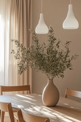 Fototapeta premium Natural light enhances a stylish dining area featuring a minimalist wooden table, elegant pendant lights, and a striking olive branch arrangement in a neutral-toned vase
