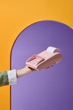Hand holding a POS machine: successful payment
