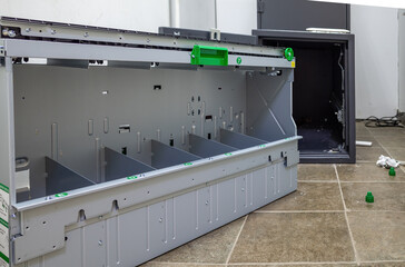 ATM repair from the back, open safe with removed cassette dispenser