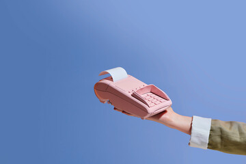 Pink Handheld Payment Terminal Against Blue Background