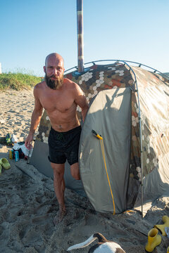 Bearded Man From Mobile Bath Tent By The Sea Beach 