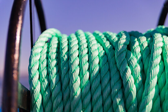 Winding Light Green Rope of Anchor At Sunset