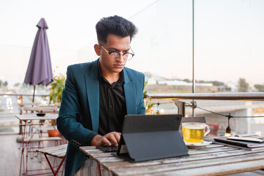 Businessman  in a jacket solves work issues