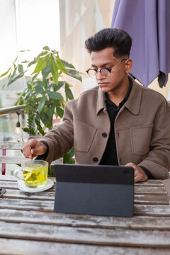 Businessman  in a jacket solves work issues