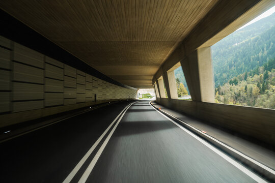 Fototapeta Road through tunnel in Swiss Alps