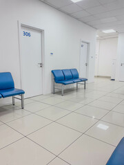 Blue Waiting Room Chairs in a Medical Office Corridor