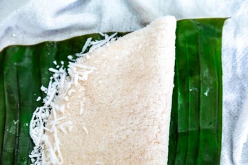 Traditional Brazilian tapioca with coconut served on a banana leaf. Amazonian tapioca
