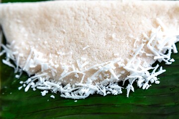 Traditional Brazilian tapioca with coconut served on a banana leaf. Amazonian tapioca
