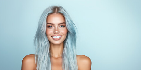 Fototapeta premium Young adult with stunning blue hair and bright smile posing against a light backdrop, showcasing fitness and beauty