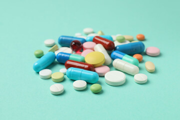 Various pills on color background