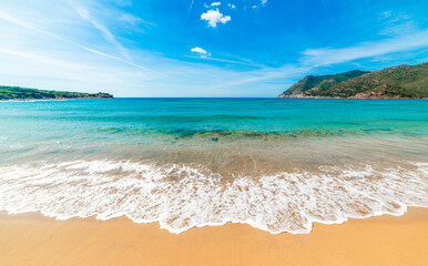 Golden sand and turquoise water in a beach in Sardinia