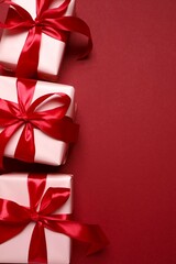 Beautiful gift boxes on red background