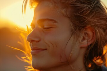 Individual enjoying fresh air with a smile, promoting spiritual well-being and a sense of freedom in a natural outdoor setting