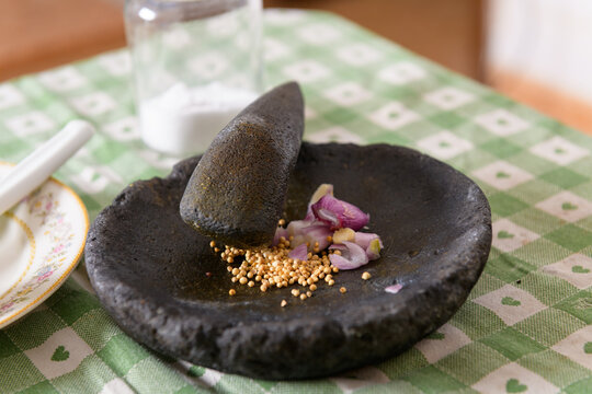Indonesian stone mortar Cobek and pestle with spices