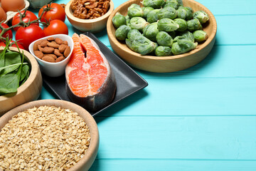Different fresh products rich in melatonin on light blue wooden table, closeup