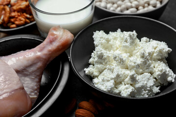 Different fresh products rich in estrogen on grey table, closeup