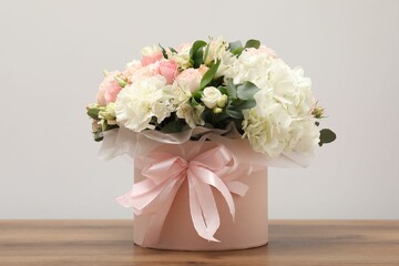Bouquet of beautiful flowers on wooden table