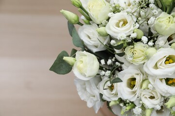 Beautiful wedding bouquet on light background, closeup. Space for text