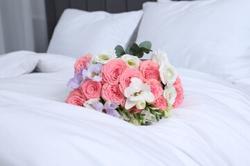 Wedding bouquet of beautiful flowers on bed