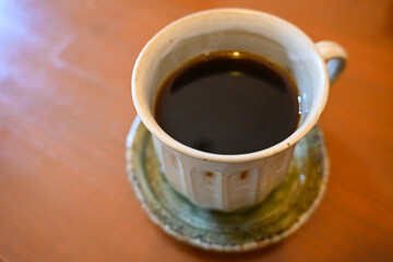 cup of coffee on wooden table