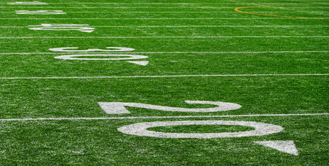 Football Field with Yardage Markers on Turf for Competition and Entertainment