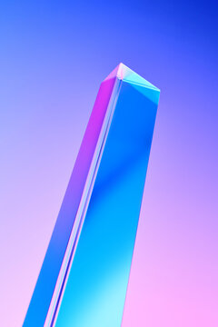 Glassy angular column rising in height over gradient purple background