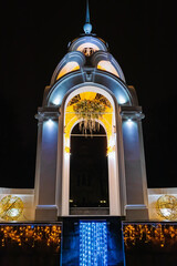 Beautiful white gazebo Mirror Stream in Kharkiv city, Ukraine. Glowing garlands decorate an...