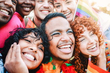 Diverse group of people celebrate LGBT pride together. Gay young community
