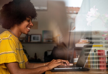 Black woman working at laptop