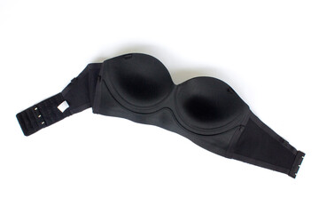 A black strapless cup bra, isolated on white background