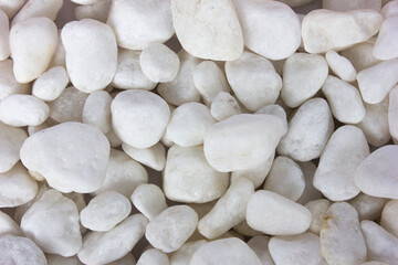 Texture pattern of white pebbles gravel and small stones in walk way path and floor for garden...