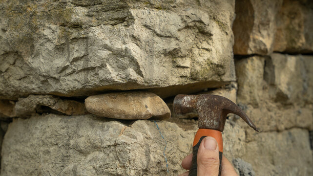 Placing rocks and stone in yard..