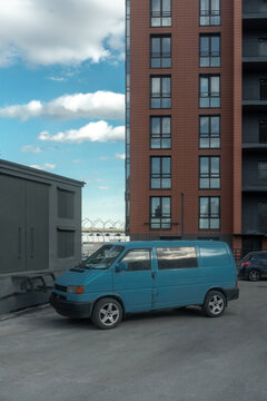 Blue Van Parked in Urban Area